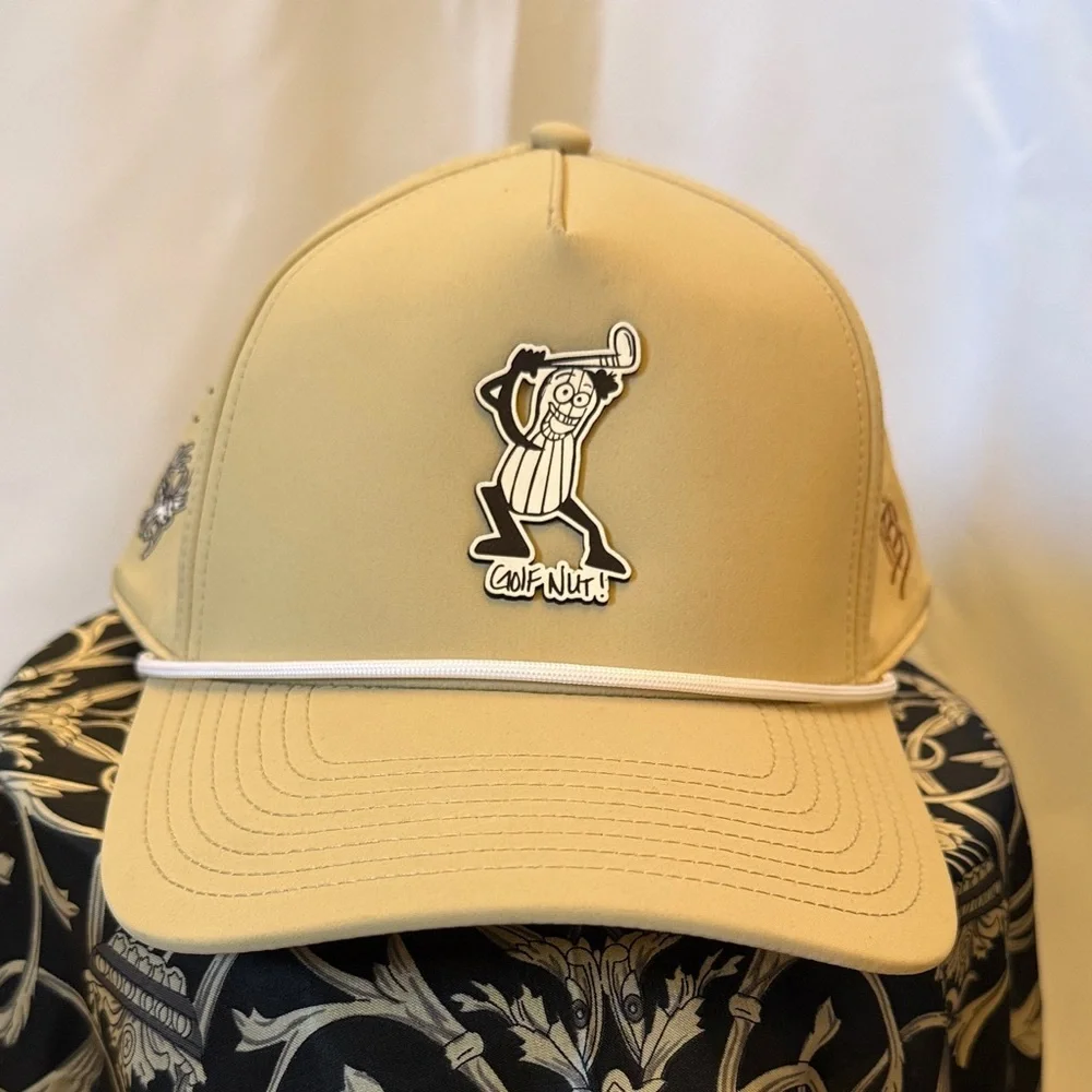 Tan golf nut cap by branded bills with Cartoon Golfer Design